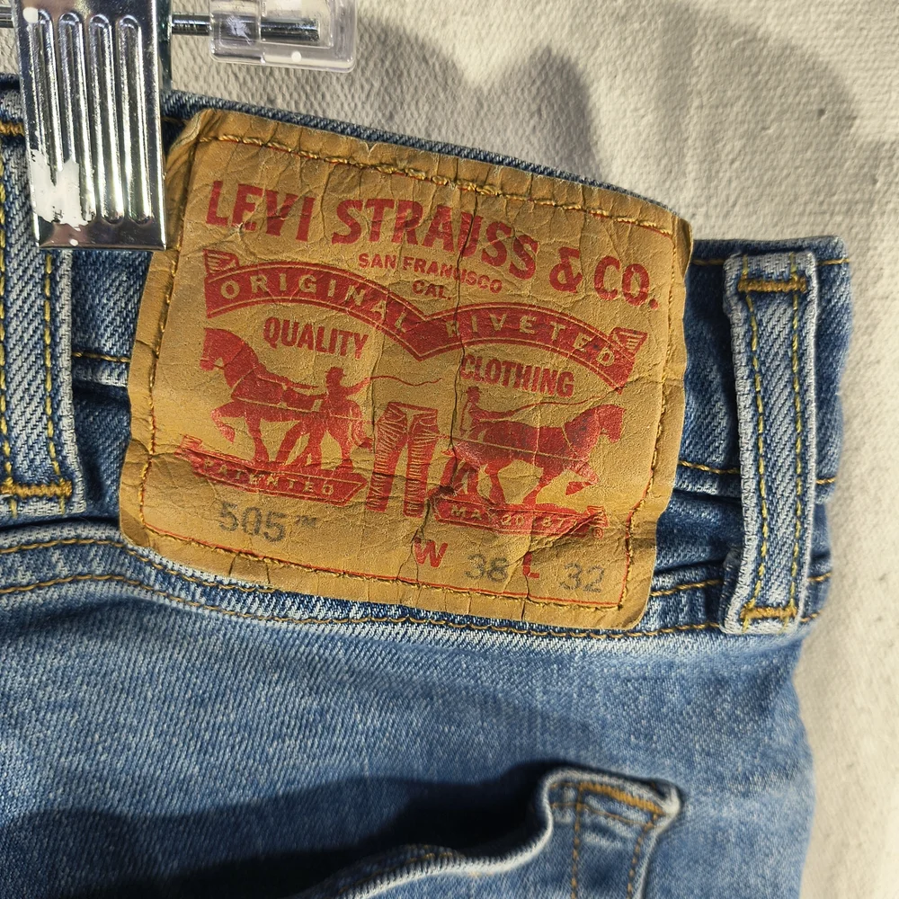 Levi's 505 Men's Size 38 X 32 Light Blue Distressed Straight Jeans